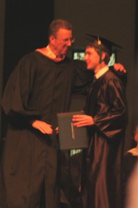James getting his diploma from Dr. Grant
