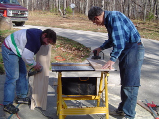 Gary and Woody making shelves for Nathan