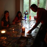 settlers by candlelight after a thunderstorm knocked out the power