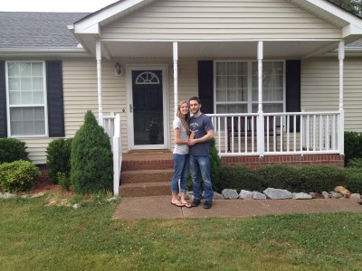 Rennah and I in front of our new house
